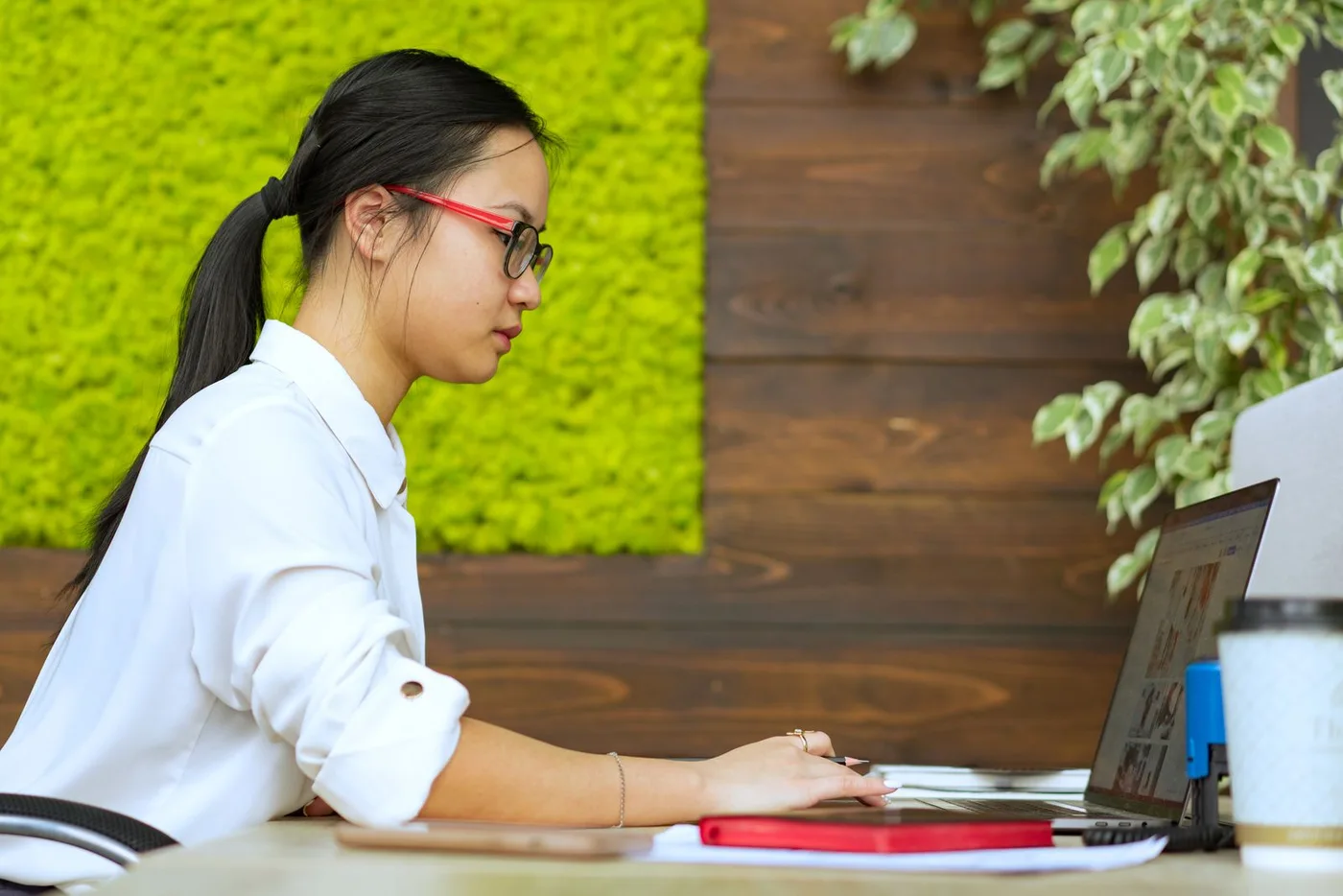 Editorial photograph of a professional working at a laptop